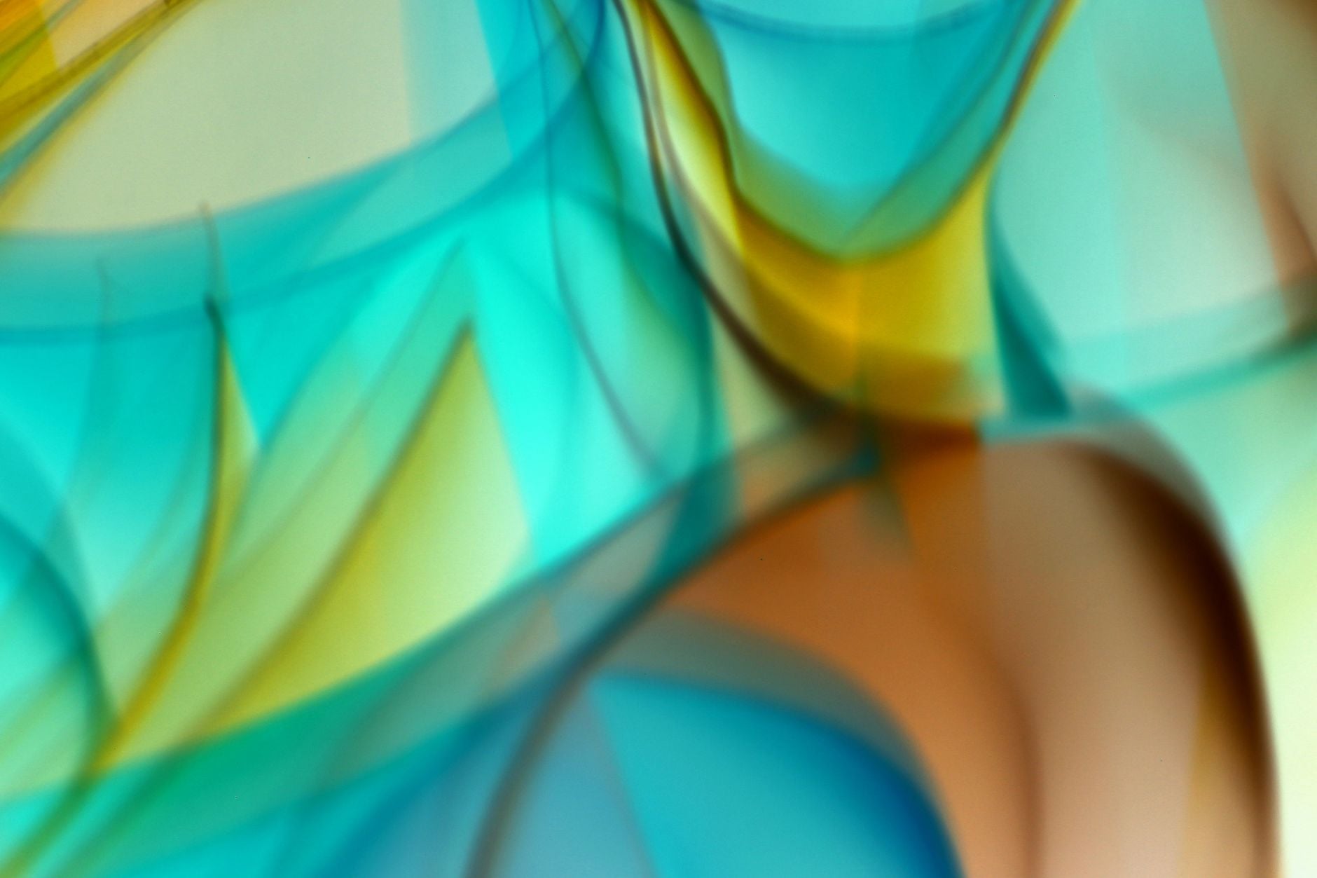 Abstract art featuring vibrant flowing colors in blue, green, and yellow hues.